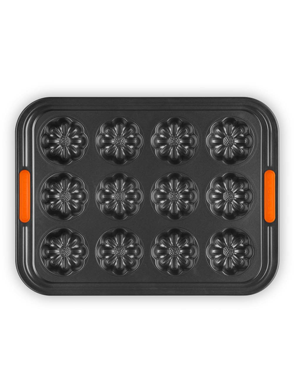 Flat lay image of metal muffin tray in shape of mini flowers